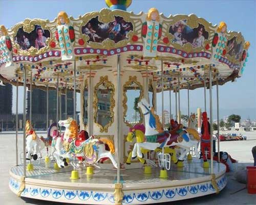 Small antique fairground carousel ride